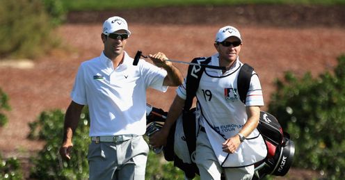 Quiros (L) coming down the back nine with his caddy on Saturday