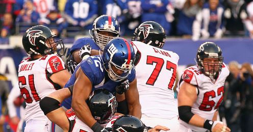 Mincemeat: New York¿s Umenyiora (72) sacks Atlanta's Matt Ryan in the NFC Wild Card Playoffs