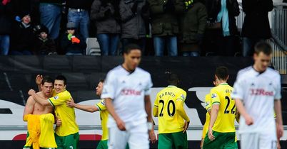 Holt double stuns Swansea