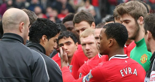 Luis Suarez and Patrice Evra