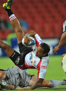 James Kamana of the Lions is tackled by Hurricanes 2012 James Kamana of the Lions is tackled by Hurricanes 2012