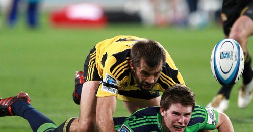 Colin Slade is tackled by Conrad Smith Colin Slade is tackled by Conrad Smith