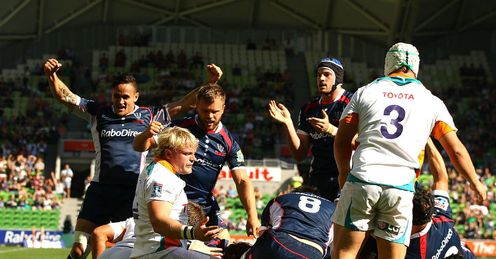 Rebels players celebrate a try from Adam Freier Rebels players celebrate a try from Adam Freier