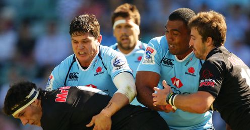 Waratahs centre Tom Carter tackling Sharks flank Marcell Coetzee Waratahs centre Tom Carter tackling Sharks flank Marcell Coetzee