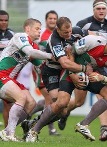 Raphael Lakafia of Biarritz is tackled by Jamie Noon Brive Raphael Lakafia of Biarritz is tackled by Jamie Noon Brive