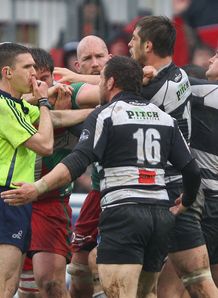 Referee George Clancy attempts to break up a brawl Referee George Clancy attempts to break up a brawl