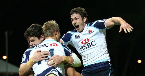 Tom Kingston C of the Waratahs is congratulated by Tom Carter and Brendan McKibbin Tom Kingston C of the Waratahs is congratulated by Tom Carter and Brendan McKibbin