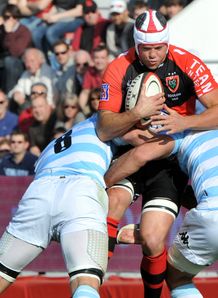 Toulon s Joe van Niekerk tackled by racing metro Toulon s Joe van Niekerk tackled by racing metro