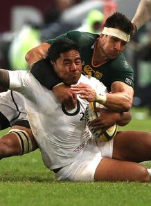 Manu Tuilagi of England is tackled by Pierre Spies South Africa Manu Tuilagi of England is tackled by Pierre Spies South Africa