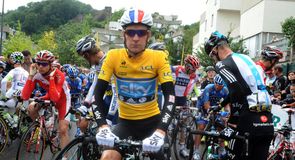Bradley Wiggins sporting the leader's yellow jersey at the start in Givors