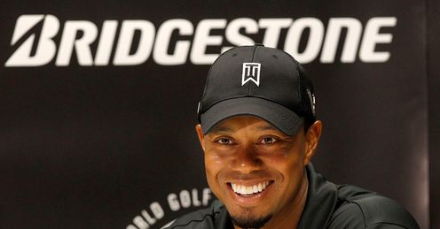 A confident, smiling Tiger Woods at a media conference on Monday