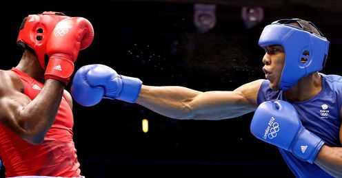 Narrow victory: Joshua (R) edged past Cuba's Erislandy Savon at the ExCel