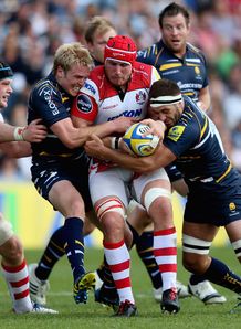 Gloucester eight Ben Morgan held by Worcester centre Joe Carlisle Gloucester eight Ben Morgan held by Worcester centre Joe Carlisle