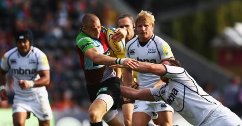 Mike Brown of Harlequins breaks through the Sale Sharks backs Mike Brown of Harlequins breaks through the Sale Sharks backs