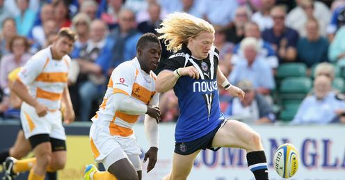 Tom Biggs of Bath kicks the ball upfield to beat Christian Wade Tom Biggs of Bath kicks the ball upfield to beat Christian Wade