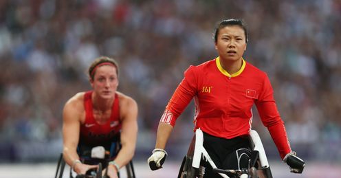 Wenju Liu of China crosses the line to win gold ahead of bronze medallist Tatyana Mcfadden of the United States