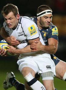 Mark Cueto of Sale is tackled by Worcester s Sam Betty