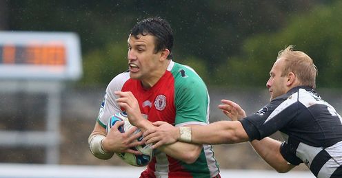 Damien Traille of Biarritz is tackled ACC Damien Traille of Biarritz is tackled ACC