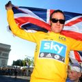 Historic moment: Wiggins celebrates becoming the first British rider to win the Tour de France