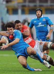 Luke Mclean of Italy is tackled by Siviteni Mafi of Tonga Luke Mclean of Italy is tackled by Siviteni Mafi of Tonga