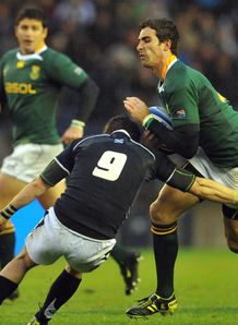 Ruan Pienaar of South Africa is tackledin Scotland Ruan Pienaar of South Africa is tackledin Scotland