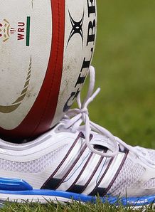 Rugby ball in trainer