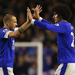 Heitinga (L): Pops up with the goods