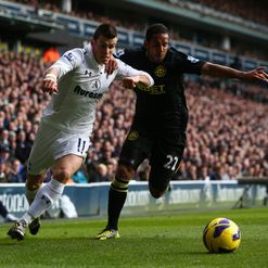 Gareth Bale taking on Ivan Ramis