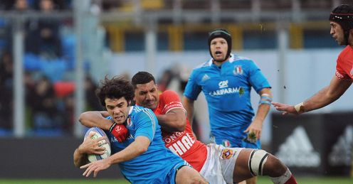 Luke Mclean of Italy is tackled by Siviteni Mafi of Tonga Luke Mclean of Italy is tackled by Siviteni Mafi of Tonga
