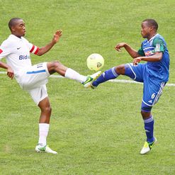 Sibusiso Vilakazi and Stanley Kgatla vie for the ball