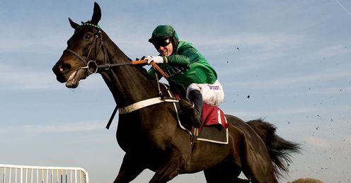 Tony McCoy riding Grandouet to victory in The Betfair Hurdle Race at Haydock in November 2011