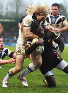 Christian Wade of London Wasps is tackled by Tom Biggs of Bath Christian Wade of London Wasps is tackled by Tom Biggs of Bath