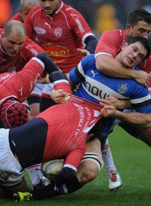 Francois Louw of Bath is tackled by Agen