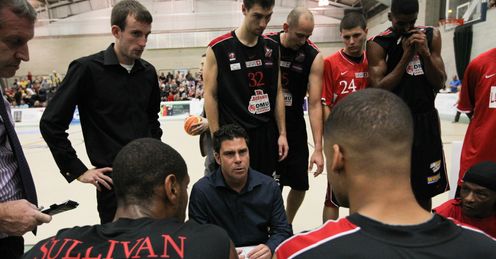 Riders coach Rob Paternostro delivers a team talk to his charges