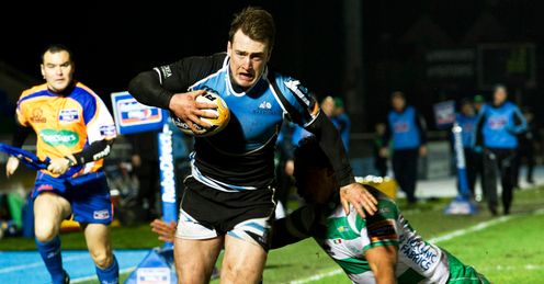 Glasgow Warriors Stuart Hogg speeds past from Loamanu Christian of Treviso Glasgow Warriors Stuart Hogg speeds past from Loamanu Christian of Treviso