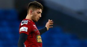 Scarlets stutter into semis