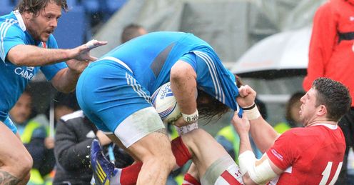 Alex Cuthbert R of Wales tackles Italian Martin Castrogiovanni Alex Cuthbert R of Wales tackles Italian Martin Castrogiovanni