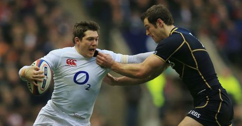 Alex Goode of England hands off Tim Visser of Scotland Alex Goode of England hands off Tim Visser of Scotland