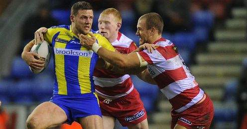 Simon Grix Warrington tackled by Liam Farrell and Lee Mossop of Wigan Simon Grix Warrington tackled by Liam Farrell and Lee Mossop of Wigan