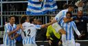 Malaga secure famous victory