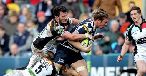 Andy Powell of Sale Sharks is hauled down by Ross Chisholm and George Lowe of Harlequins Andy Powell of Sale Sharks is hauled down by Ross Chisholm and George Lowe of Harlequins