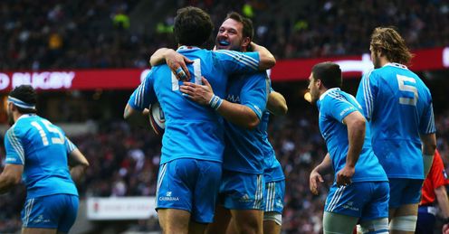 Luke McLean of Italy celebrates scoring their first try with Alberto De Marchi Luke McLean of Italy celebrates scoring their first try with Alberto De Marchi