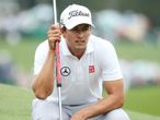 Banned: Adam Scott with his long putter