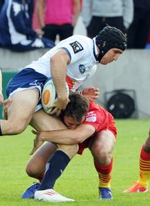 Agen s Romain Edmond Samuel 2nd L is tackled by Perpignan Agen s Romain Edmond Samuel 2nd L is tackled by Perpignan