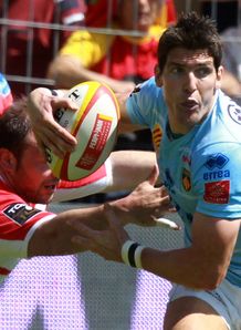 Perpignan s fly half James Hook is tackled by Biarritz Perpignan s fly half James Hook is tackled by Biarritz