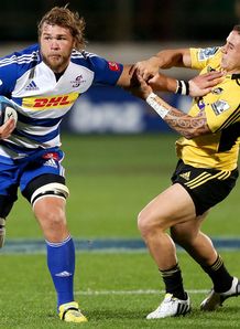 Stormers forward Duane Vermuelen handing off Hurricanes back TJ Perenara Stormers forward Duane Vermuelen handing off Hurricanes back TJ Perenara