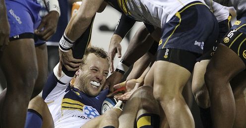 Brumbies full back Jesse Mogg celebrating on the ground Brumbies full back Jesse Mogg celebrating on the ground