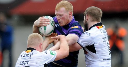 Liam Farrell Wigan Warriors tackled by three Bradford players Liam Farrell Wigan Warriors tackled by three Bradford players