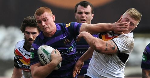 Jack Hughes Wigan Warriors handing off Danny Addy of Bradford Bulls Jack Hughes Wigan Warriors handing off Danny Addy of Bradford Bulls