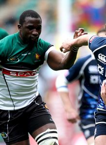 Lee Jones of Scotland hands off the tackle of Daniel Hondo of Zimbabwe london sevens Lee Jones of Scotland hands off the tackle of Daniel Hondo of Zimbabwe london sevens